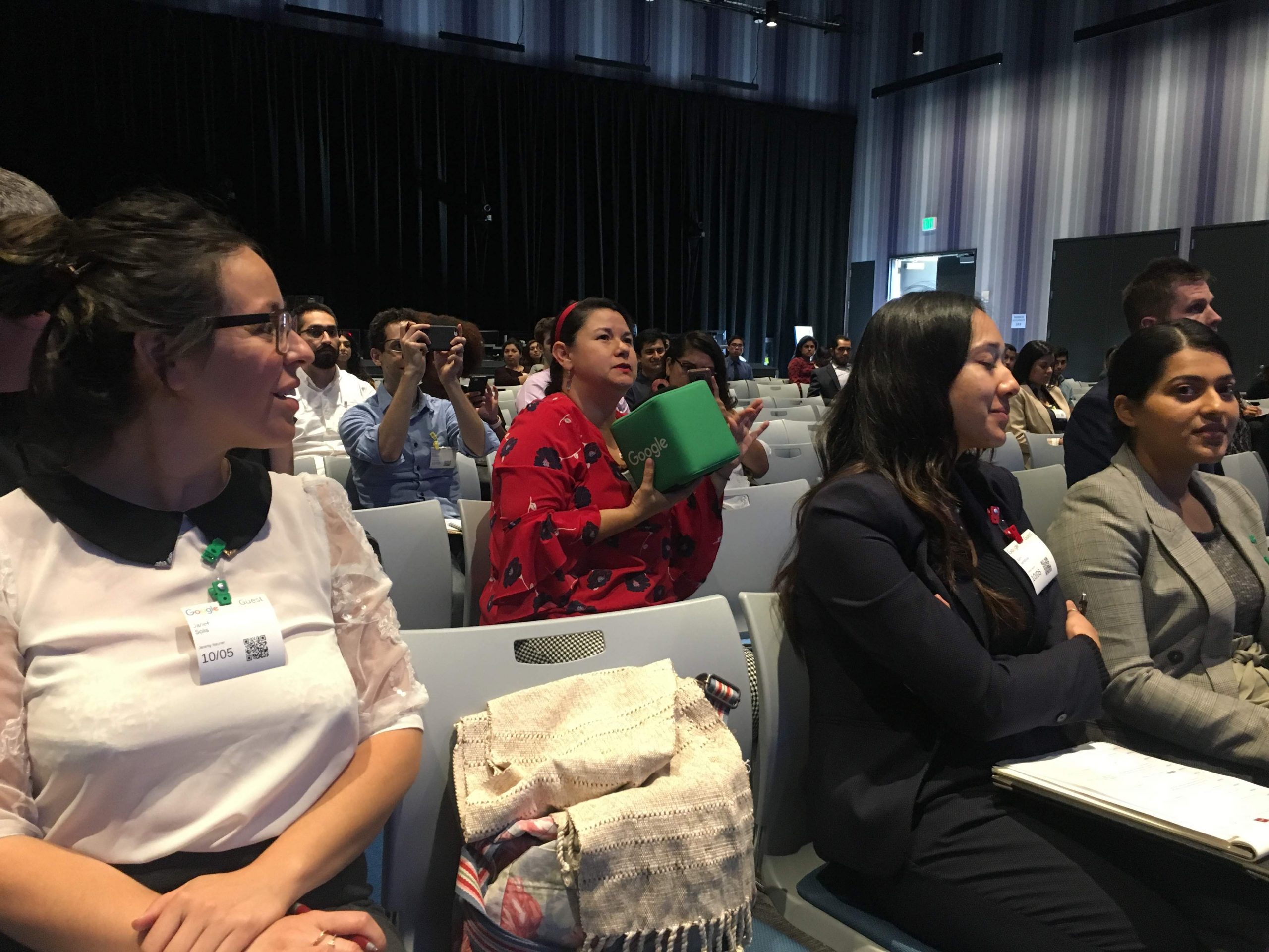 Audience members listening during the SaludConTech symposium