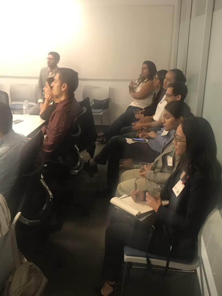Audience members listening during a breakout session
