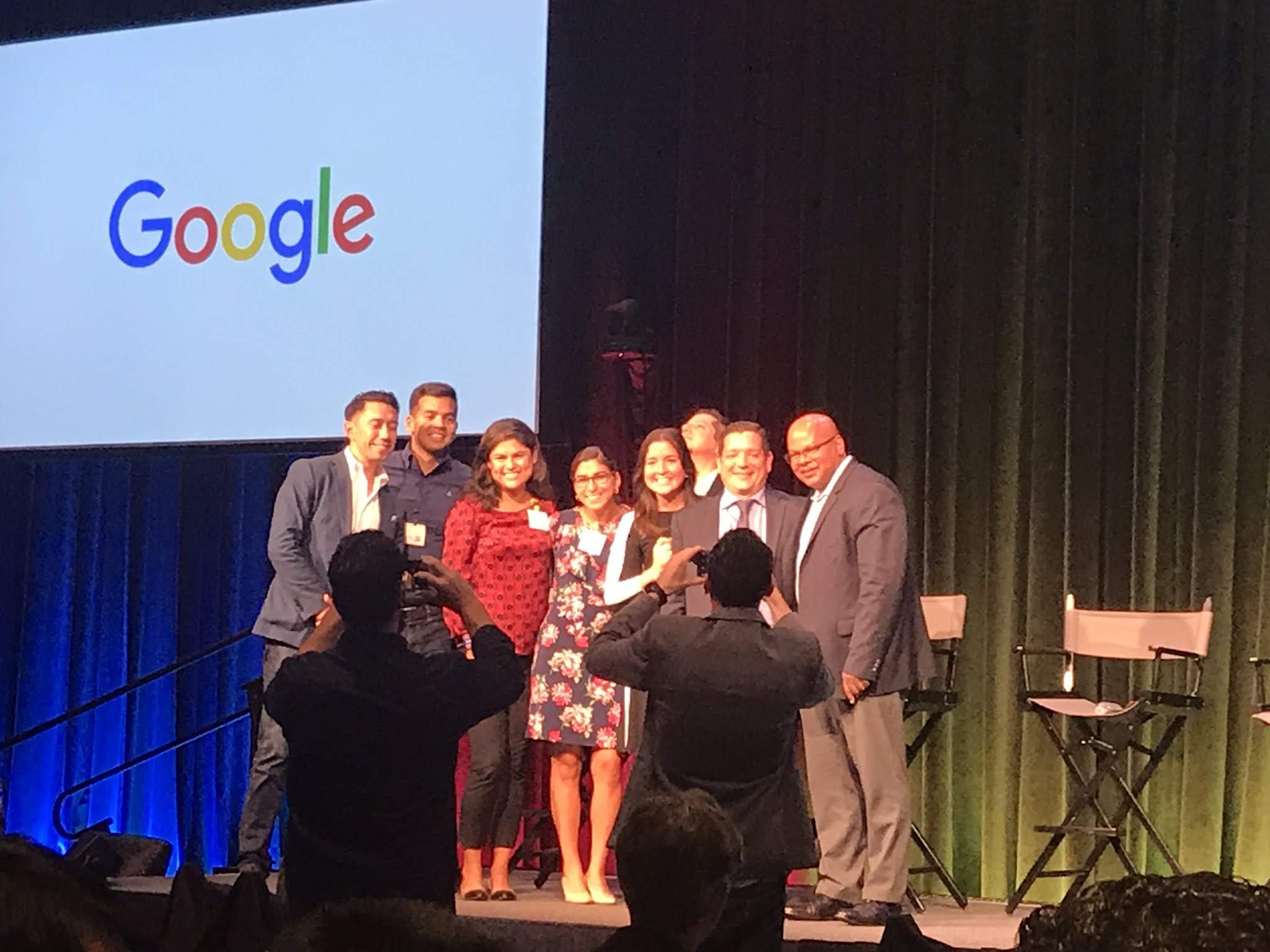 Community members gathered on the symposium stage