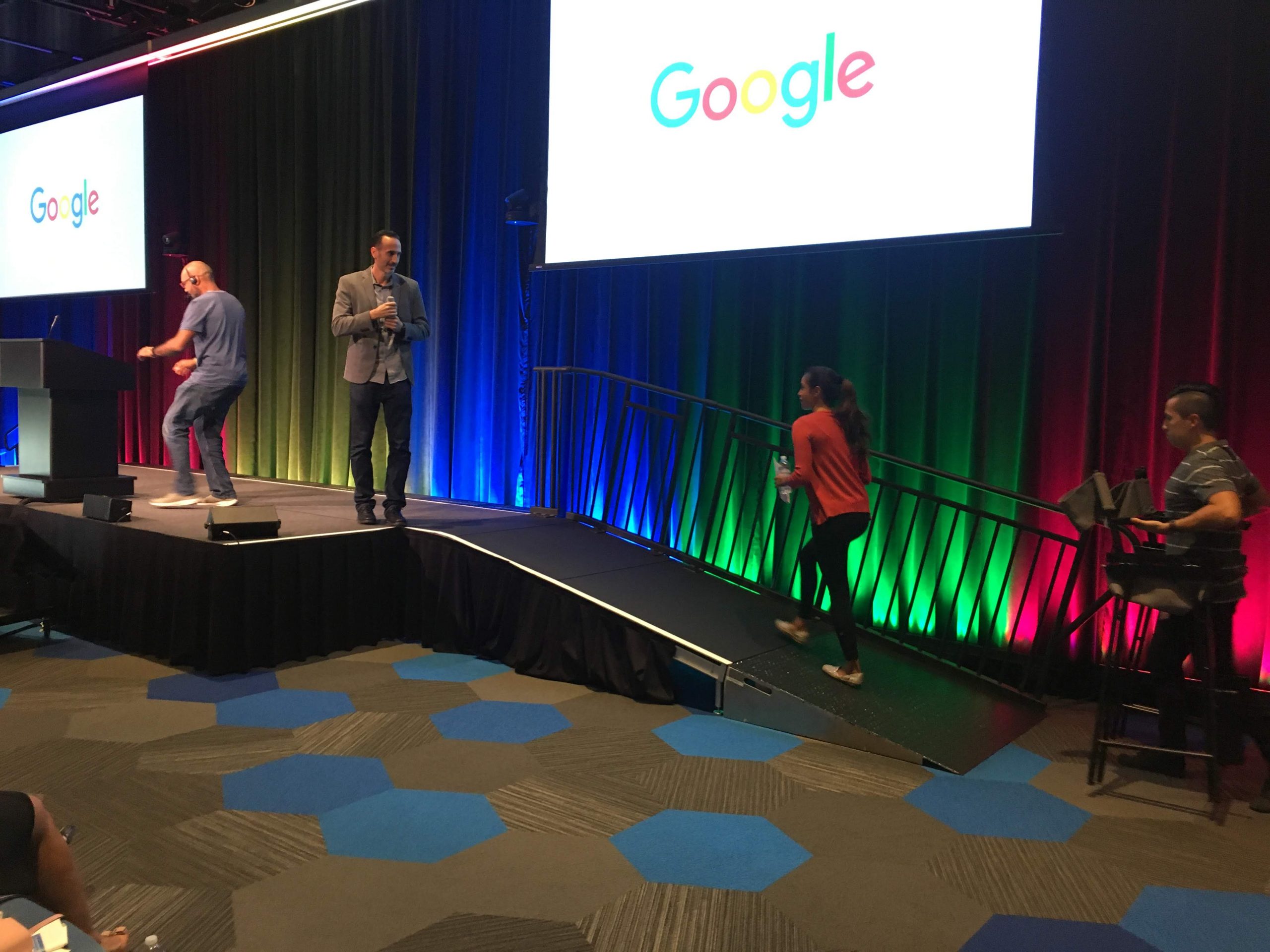 Speakers in conversation on the symposium stage